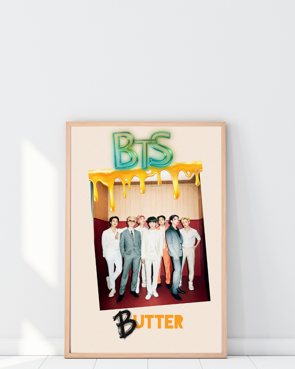 Framed BTS Butter poster displayed in a trendy interior, adding a fun and vibrant K-pop touch with bright colors and pop-inspired design.