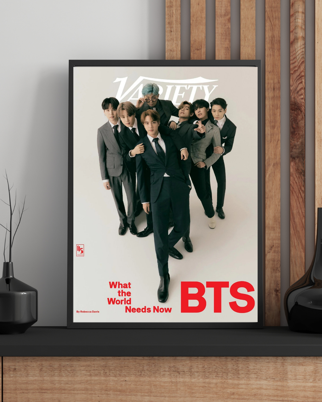 Framed BTS poster displayed in a contemporary interior, adding a sleek and fashionable K-pop touch with minimalist styling and strong visual impact.
