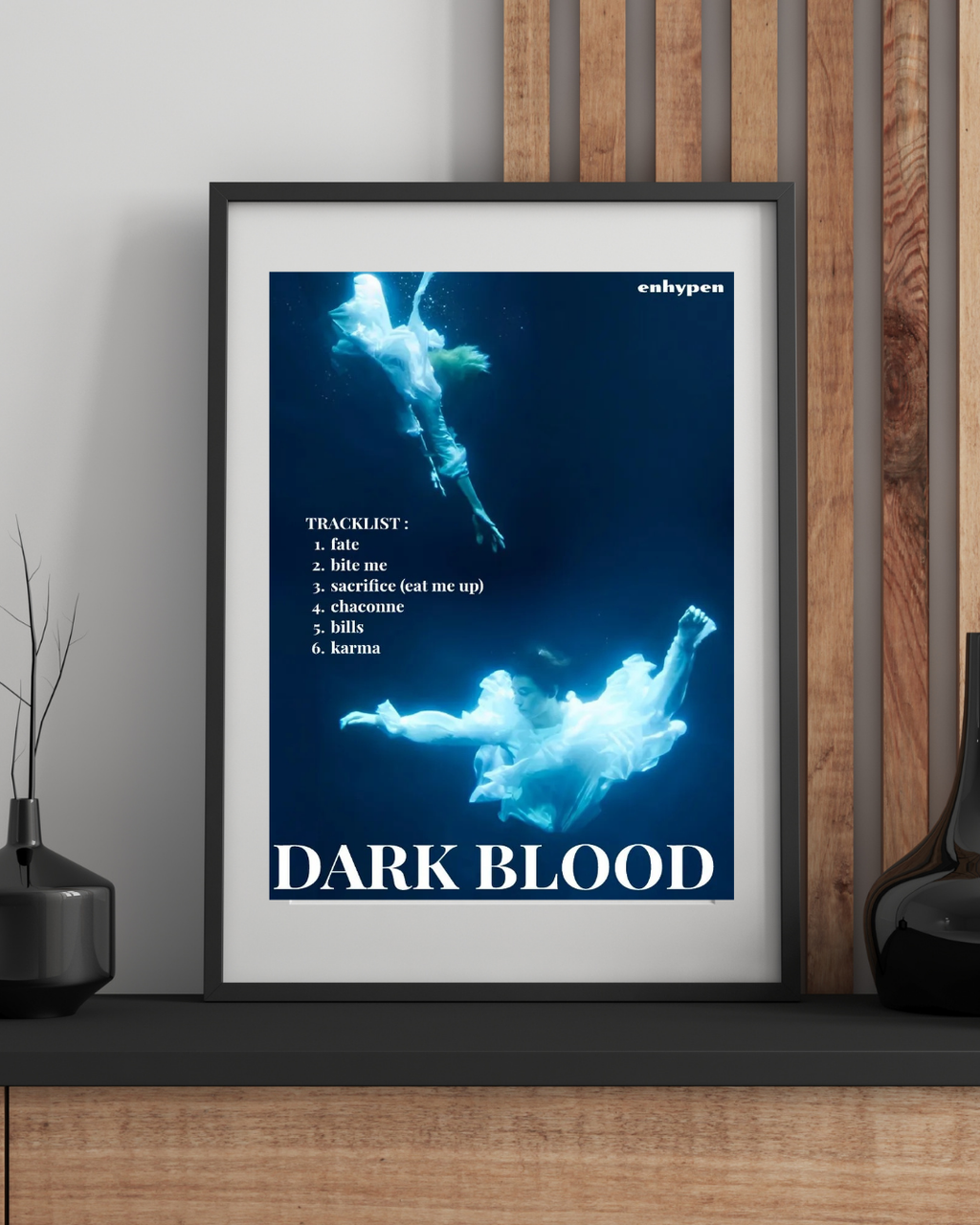 Framed ENHYPEN Dark Blood underwater poster displayed in a modern room, creating a serene and artistic K-pop wall decor with soft blue tones.
